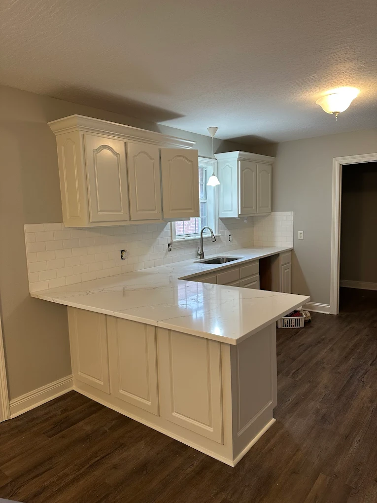 A remodeled kitchen with fresh cabinets, counters and tile
